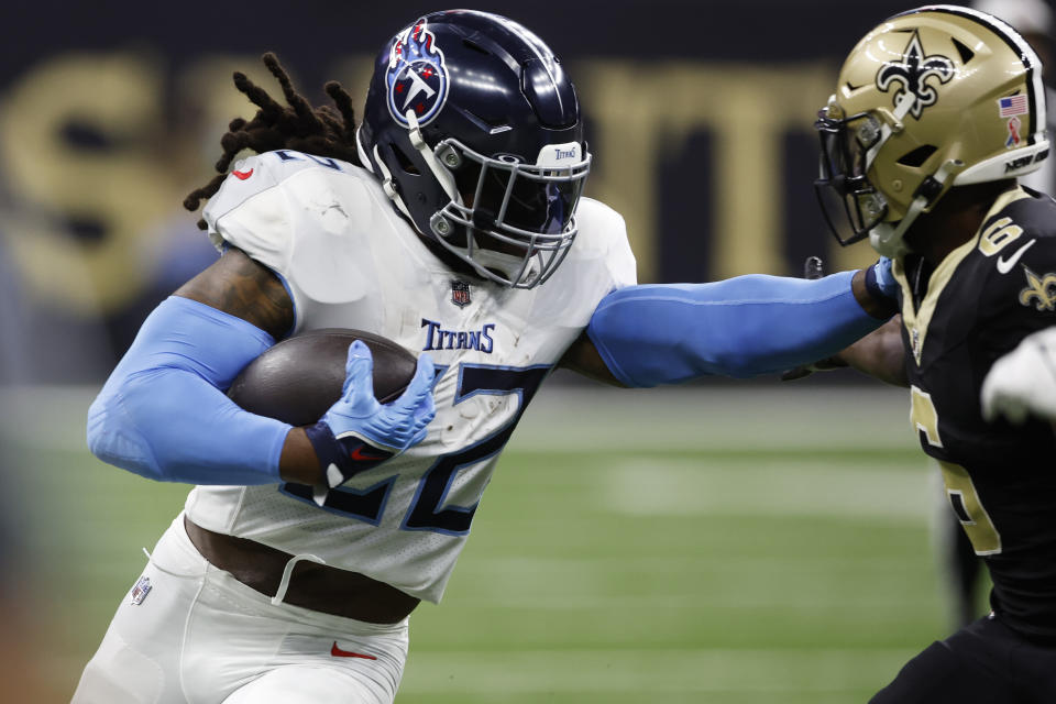 Tennessee Titans running back Derrick Henry, left, stiff arms New Orleans Saints safety Marcus Maye, right, in the first half of an NFL football game in New Orleans, Sunday, Sept. 10, 2023. (AP Photo/Butch Dill)
