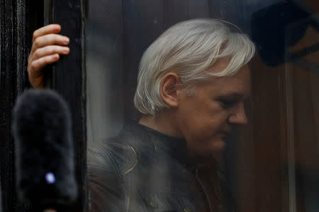 FILE PHOTO: WikiLeaks founder Julian Assange is seen on the balcony of the Ecuadorian Embassy in London, Britain, May 19, 2017. REUTERS/Peter Nicholls/File Photo