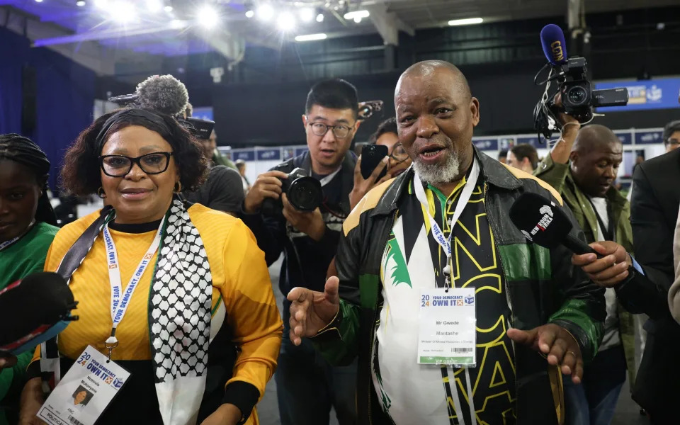ANC deputy secretary-general Nomvula Mokonyane, left, arrives at the Independent Electoral Commission National Results Center at Gallagher Convention Centre