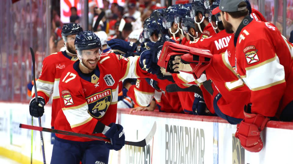 Evan Rodrigues #17 of the Florida Panthers celebrates with teammates on the bench after a goal by teammate Oliver Ekman-Larsson #91 (not pictured) during Game Five of the 2024 Stanley Cup Final. - Dave Sandford/NHLI/Getty Images