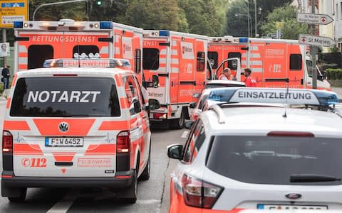 Ambulance cars stand in front of the Buergerhospital clinic, from where patients are being moved to another hospital - Credit: Frank Rumpenhorst/DPA