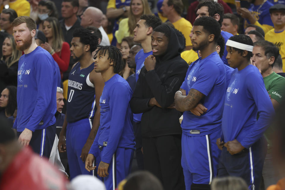 Dallas Mavericks players watch from the bench area during the second half of Game 2 of the NBA basketball playoffs Western Conference finals against the Golden State Warriors in San Francisco, Friday, May 20, 2022. (AP Photo/Jed Jacobsohn)