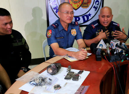 Philippine National Police (PNP) chief Director General Ronald Dela Rosa points at a part of an Improvised Explosive Device (IED) found near the U.S Embassy during a press conference in Manila, Philippines November 28, 2016. REUTERS/Romeo Ranoco