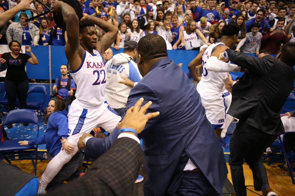 LAWRENCE, KANSAS - JANUARY 21:  Silvio De Sousa #22 of the Kansas Jayhawks picks up a chair during a brawl as the game against the Kansas State Wildcats ends at Allen Fieldhouse on January 21, 2020 in Lawrence, Kansas. (Photo by Jamie Squire/Getty Images)