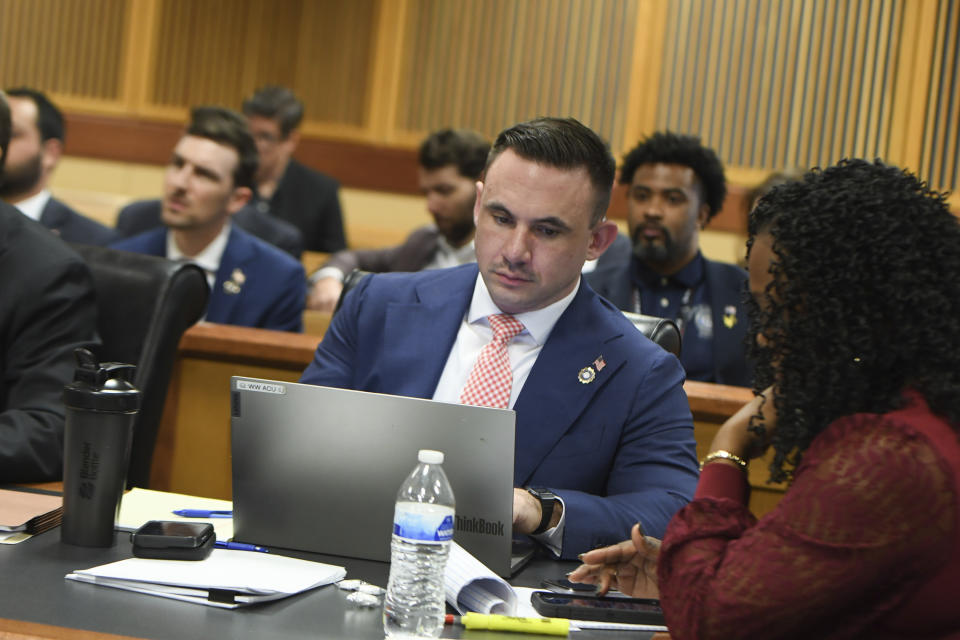 Deputy District Attorney Will Wooten listens during a hearing on charges against former President Donald Trump in the Georgia election interference case on Thursday, March 28, 2024 in Atlanta. Lawyers for Trump argued in a court filing that the charges against him in the Georgia election interference case seek to criminalize political speech and advocacy conduct that is protected by the First Amendment. (Dennis Byron/Hip Hop Enquirer via AP)