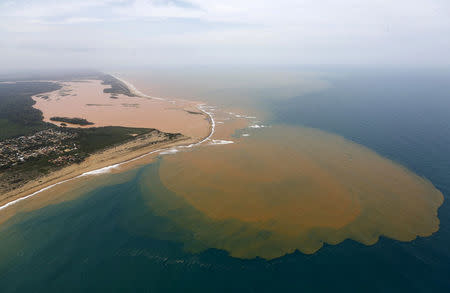 FILE PHOTO: An aerial view shows the Rio Doce (Doce River), which was flooded with mud after a dam owned by Vale SA and BHP Billiton Ltd burst, at an area where the river joins the sea on the coast of Espirito Santo in Regencia Village, Brazil, November 23, 2015. REUTERS/Ricardo Moraes/File Photo