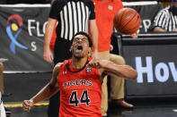 Auburn center Dylan Cardwell (44) reacts after dunking the ball against Central Florida during the second half of an NCAA college basketball game, Monday, Nov. 30, 2020, in Orlando, Fla. (AP Photo/John Raoux)