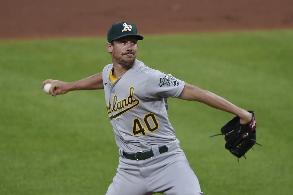Oakland Athletics pitcher Chris Bassitt throws to a Baltimore Orioles batter during the first inning of a baseball game Saturday, April 24, 2021, in Baltimore. (AP Photo/Gail Burton)