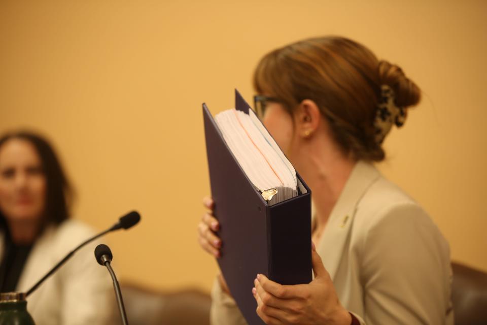 Rep. Lindsay Vaughn, D-Overland Park, holds up a binder of the written testimony from supporters of Medicaid expansion. "I think we had overwhelming support in the testimony," she said.
