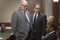 Former Las Vegas Raiders NFL football player Henry Ruggs III, seated right, waits with defense attorneys David Chesnoff, left, and Richard Schonfeld before during his sentencing hearing at the Regional Justice Center, Wednesday, Aug. 9, 2023, in Las Vegas. Ruggs pleaded guilty May to felony DUI causing death and misdemeanor vehicular manslaughter. (Steve Marcus/Las Vegas Sun via AP)