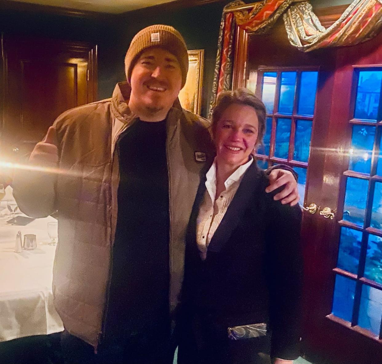 Comedian Shane Gillis poses with a staff member at Jim's Steak House in downtown Peoria.
