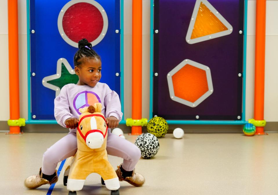 Ari’niyah, 4, plays in the indoor play space at Cincinnati Children’s Hospital Therapeutic Interagency Program.