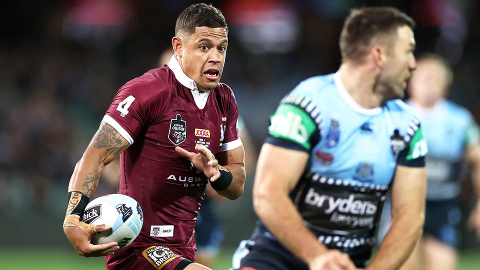 QLD's Dane Gagai is seen running with the ball during an Origin clash against NSW.