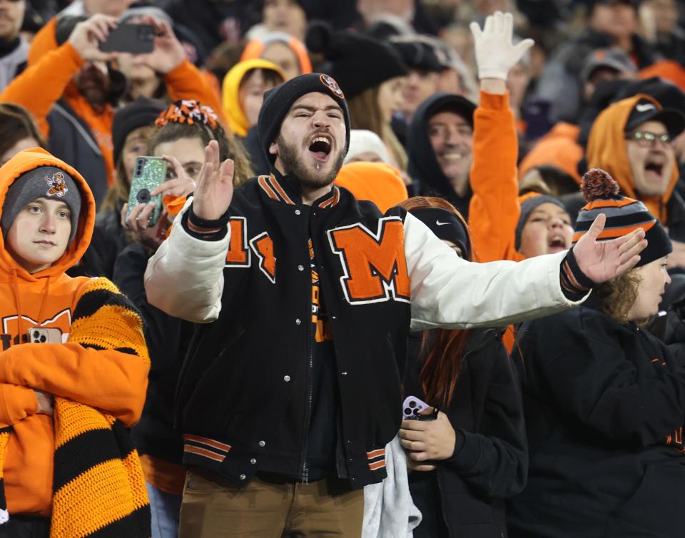 Massillon fans cheer on the Tigers as they defeated Akron Hoban on Thursday night for the Division II state championship at Tom Benson Hall of Fame Stadium in Canton.