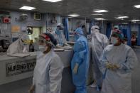 Medical workers treat patients infected with the coronavirus disease (COVID-19) at a hospital in New Delhi