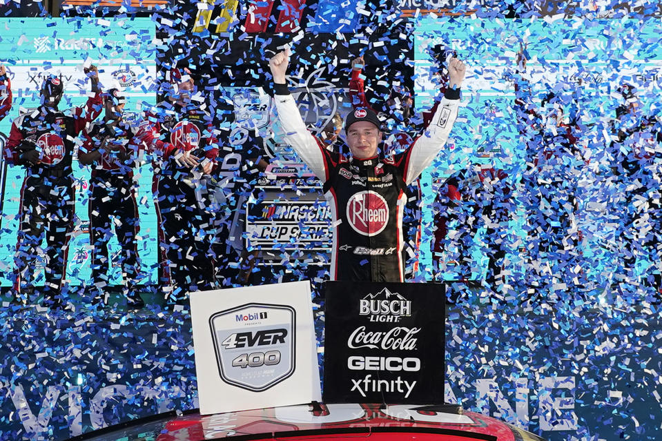 Christopher Bell, center, celebrates after winning a NASCAR Cup Series auto race at Homestead-Miami Speedway, Sunday, Oct. 22, 2023, in Homestead, Fla. (AP Photo/Wilfredo Lee)