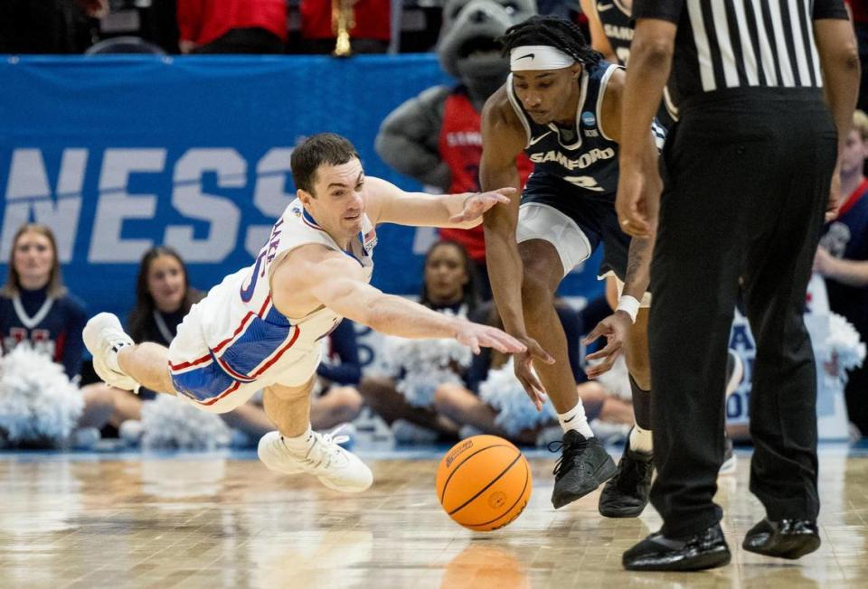 Kansas Jayhawks guard Nicolas Timberlake (25) and Samford Bulldogs guard Jaden Campbell (2) compete for a loose ball during a men’s college basketball game in the first round of the NCAA Tournament on Thursday, March 21, 2024, in Salt Lake City, Utah. Nick Wagner/nwagner@kcstar.com