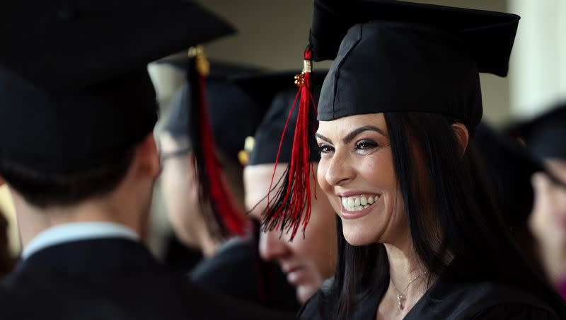 Patricia Dutra de Moraes smiles as she talks with fellow graduate Alexander Werth before receiving their certificates as the University of Utah’s English Language Institute holds the 43rd Cohort Graduation Ceremony at the Crimson View on campus in Salt Lake City on April 19.