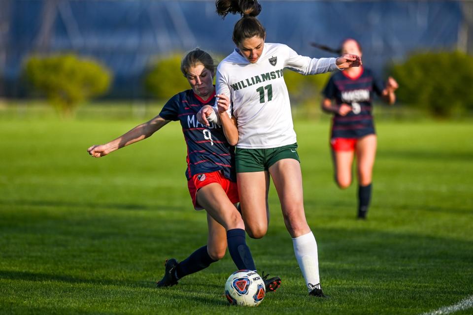 Mason's Ava Ruster, left, collides with Williamston's Leisya Newell during the first half on Wednesday, May 3, 2023, in Mason.