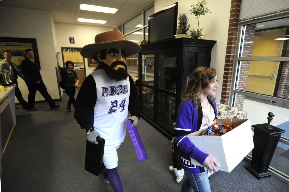 Pioneer Pete mascot walks through Lehi High School.