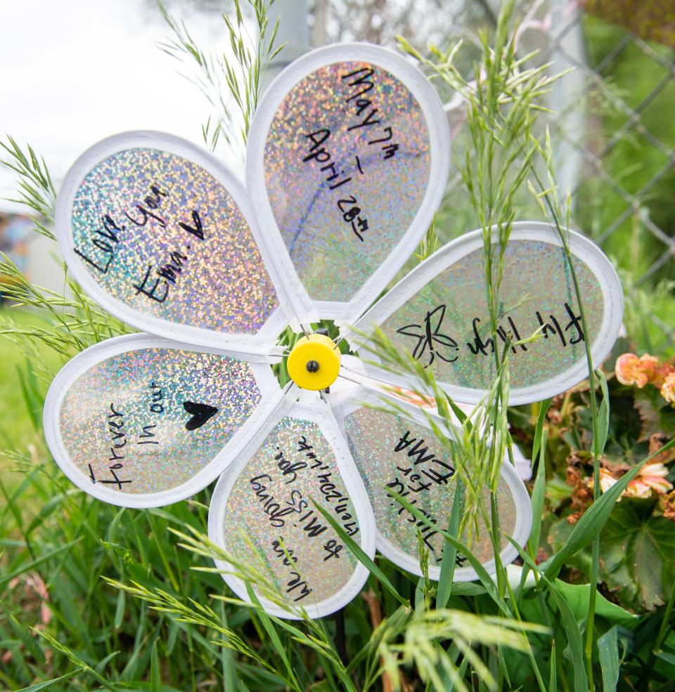 A makeshift memorial for 14-year-old Emma Cardenas near the section of East University Avenue in Des Moines where she was killed in a hit-and-run accident April 28.