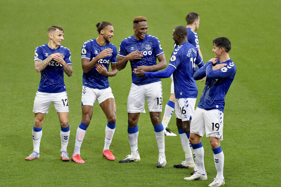 Everton players celebrating a goal against Brighton during their English Premier League clash. 