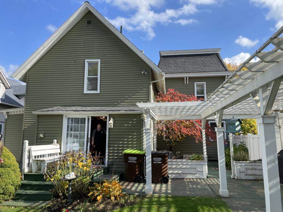 The back of the Ralstons' Borgess Avenue home is shown. The home has two different roofs, suggesting it was once two separate structures.