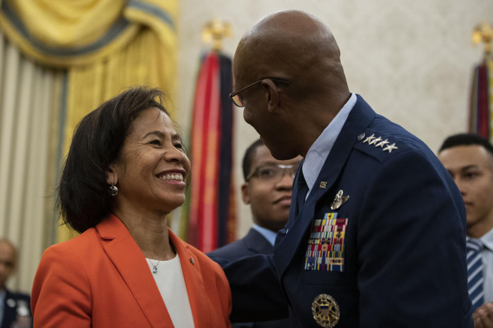 FILE - Gen. CQ Brown Jr. embraces his wife Sharene Guilford Brown after he was sworn in as Chief of Staff of the Air Force, in the Oval Office of the White House, Tuesday, Aug. 4, 2020, in Washington. President Joe Biden is expected to announce Air Force Gen. CQ Brown Jr., a history-making fighter pilot with recent experience countering China in the Pacific, to serve as the next chairman of the Joint Chiefs of Staff. If confirmed by the Senate, Brown would replace the current chairman of the Joint Chiefs of Staff, Army Gen. Mark Milley, whose term ends in October. (AP Photo/Alex Brandon, File)