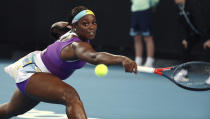 United States' Sloane Stephens makes a backhand return to China's Zhang Shuai during their first round singles match at the Australian Open tennis championship in Melbourne, Australia, Monday, Jan. 20, 2020. (AP Photo/Dita Alangkara)