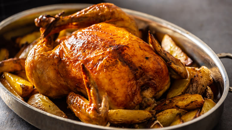 Whole roasted chicken with potatoes