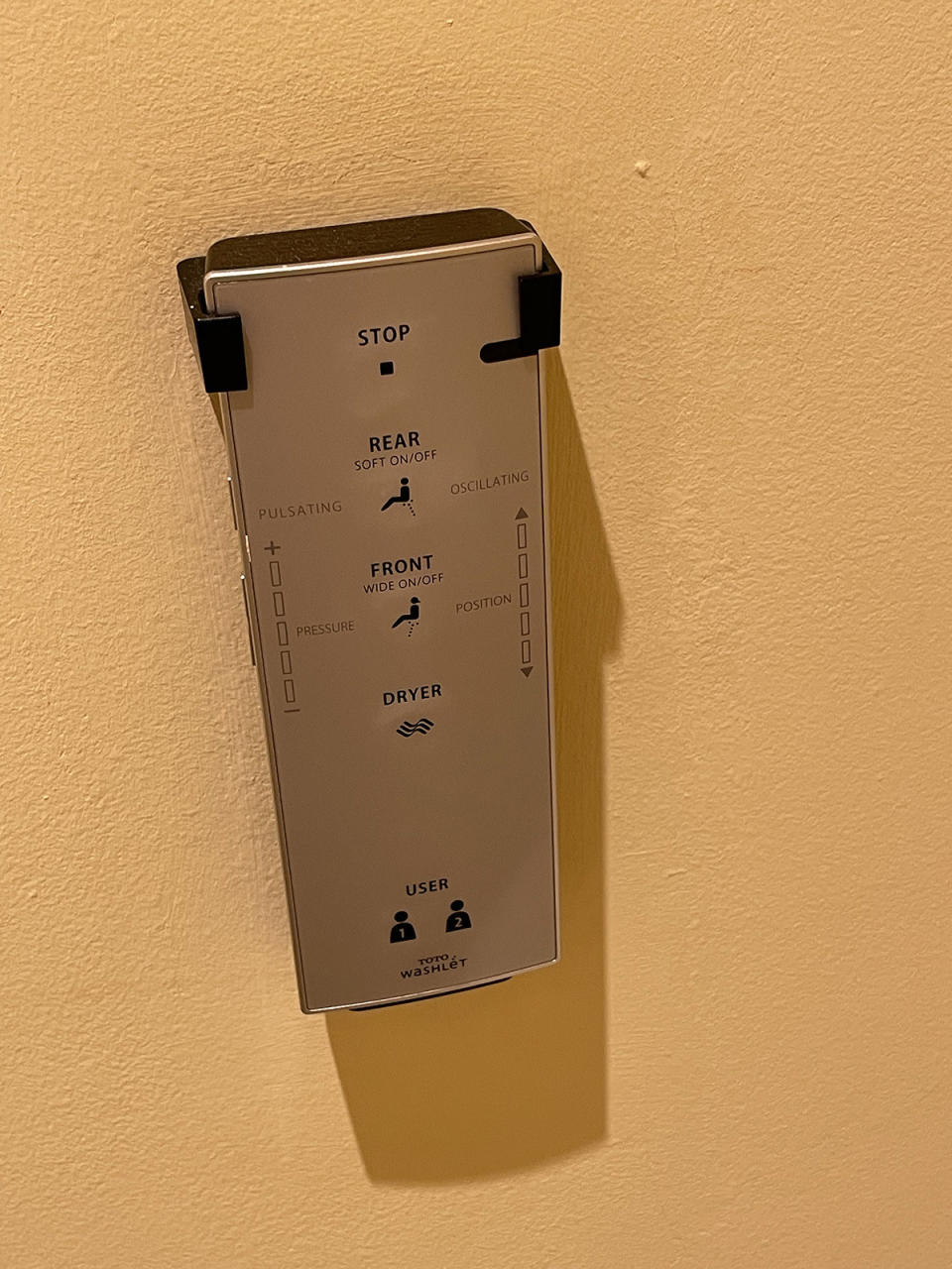 A remote control for a Toto Washlet bidet including water pressure and position controls and a button for a dryer