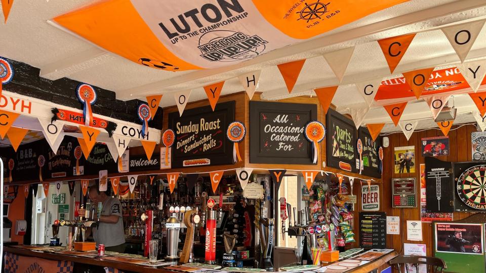 Bar area of a pub festooned with Luton Town bunting