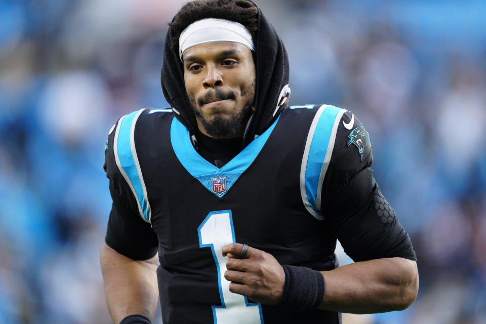 Carolina Panthers quarterback Cam Newton leaves the field after their loss against the Washington Football Team during the second half of an NFL football game Sunday, Nov. 21, 2021, in Charlotte, N.C. (AP Photo/Jacob Kupferman)