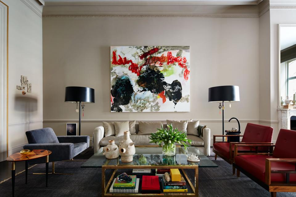 The painting in the living room is by Argentinean Brooklyn-based artist Alejandra Sever. The central sofa was custom designed and wears a cashmere velvet from Great Plains at Holly Hunt. Otero is a stickler for proportion and decided to maximize the size to fit the space. He also designed the floor lamps in dark steel with a special patina. The vintage Italian lounge chair with brass legs was reupholstered in a gray-blue suede by Edelman.