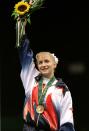 USA's Shannon Miller smiles after being awarded with the Gold medal in the women's balance beam individual event final July 29, 1996 at the XXVI Summer Olympic Games. Miller won with a score of 9.862. (Kimimasa Mayama / Reuters)