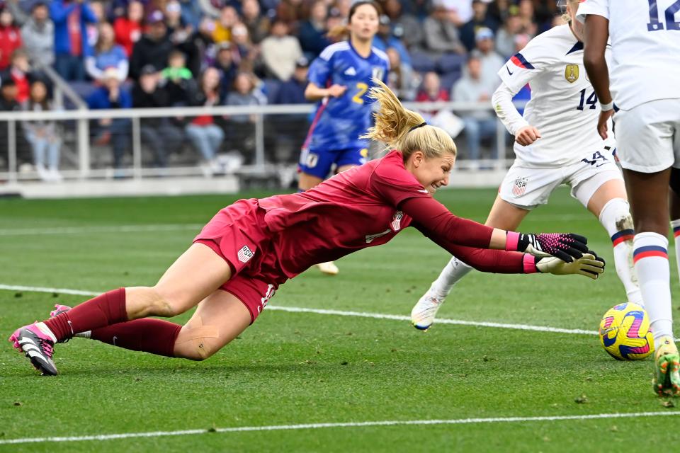 U.S. goalkeeper Casey Murphy (18) dives on the ball after blocking a shot by Japan during the second half of a SheBelieves Cup soccer match Sunday, Feb. 19, 2023, in Nashville, Tenn. The United States won 1-0. (AP Photo/Mark Zaleski)