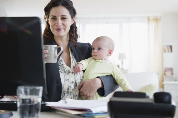 USA, New Jersey, Jersey City, Mother with baby boy (2-5 months) working from home