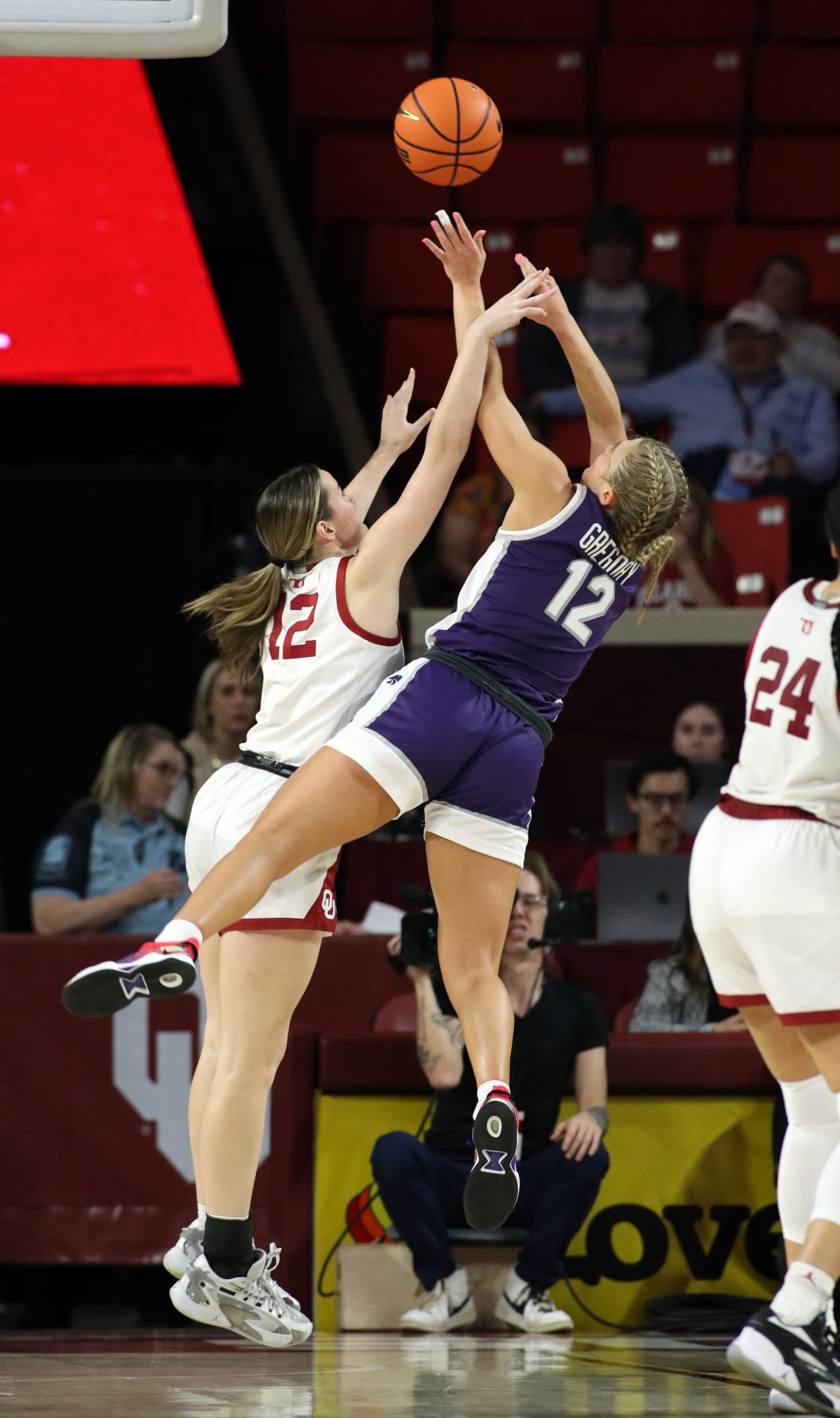 Former Sooner Gabby Gregory shoots over Payton Verhulst as the University of Oklahoma Sooner Women's basketball team plays the Kansas State Wildcats on Jan 31, 2024; Norman, Okla, [USA]; at Lloyd Noble Arena. Mandatory Credit: Steve Sisney-The Oklahoman