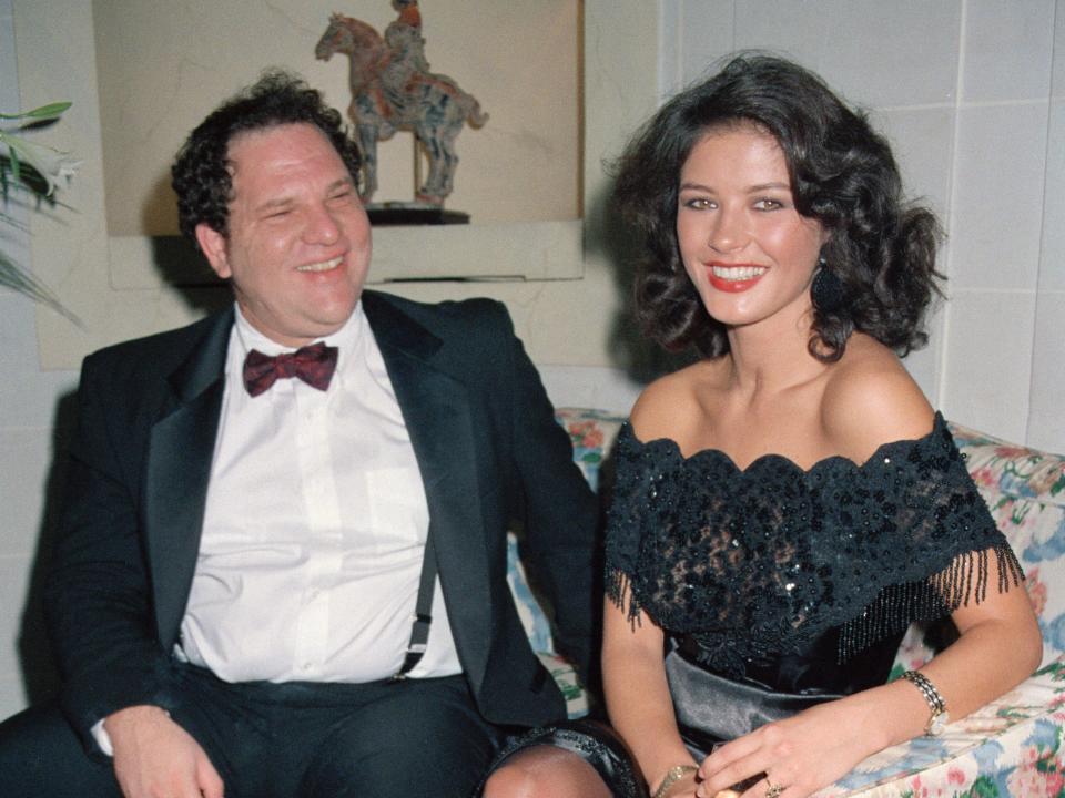 Harvey Weinstein sits next to Catherine Zeta-Jones.