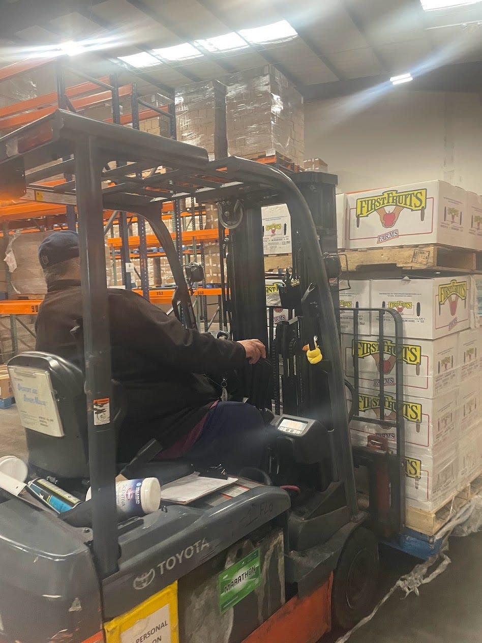 4800 pounds of apples donated by United Supermarkets are unloaded Thursday at the High Plains Food Bank in Amarillo.