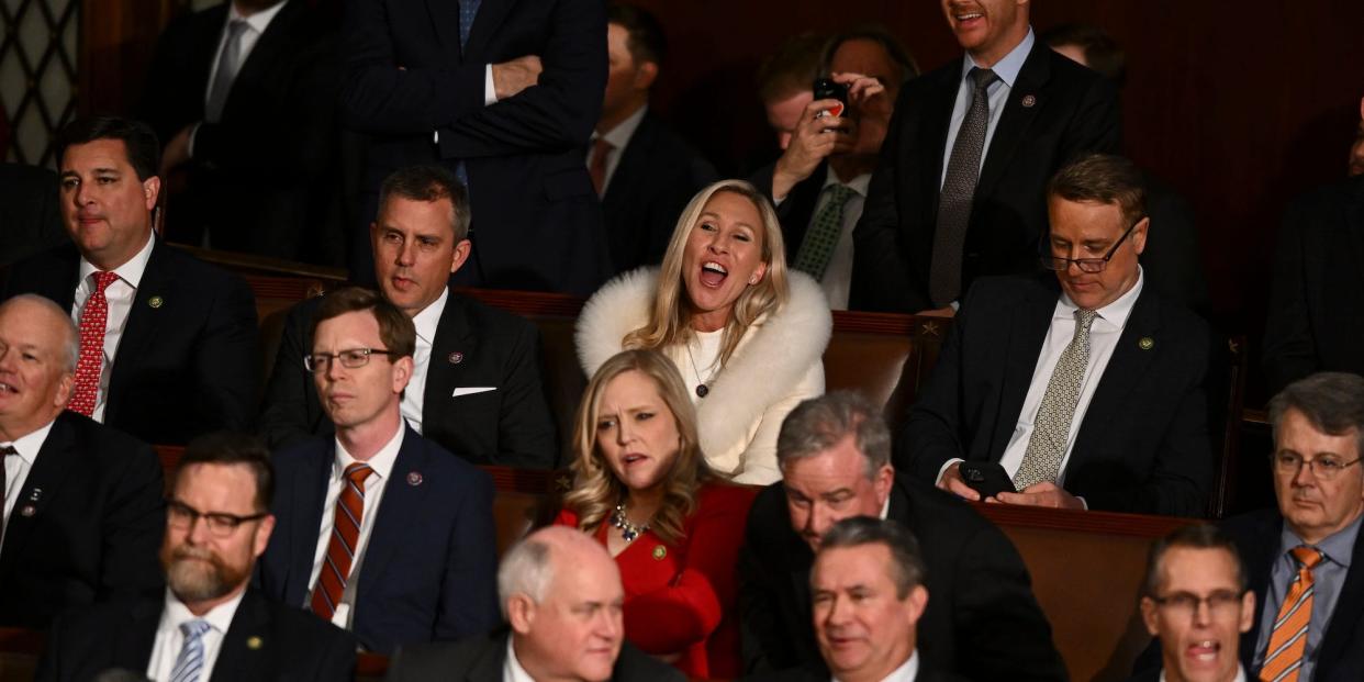 Rep. Marjorie Taylor Greene surrounded by other Republican House member at President Joe Biden’s State of the Union address on February 7, 2023.
