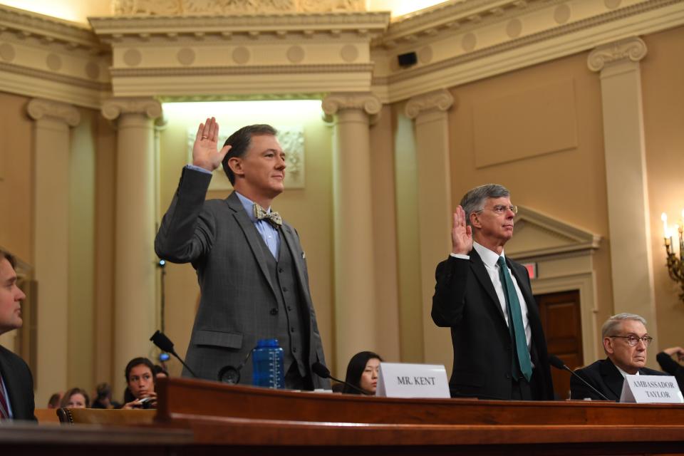 George Kent and Bill Taylor are sworn in before testifying as the first witnesses in public congressional hearings in the impeachment inquiry against President Donald Trump on Nov 13.