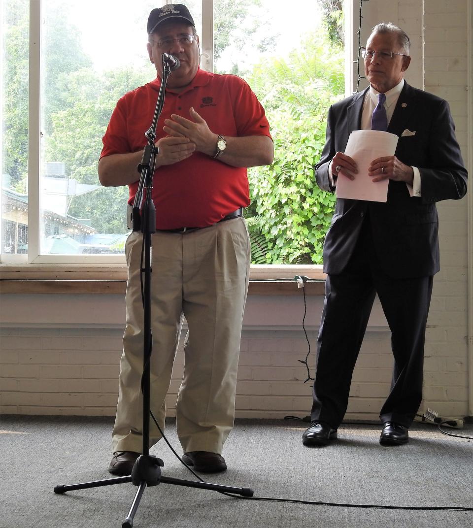 Sen. Tim Schaffer speaks at a press conference Tuesday while Mayor Don Mason looks on. Schaffer spoke about how Mason impressed upon him the importance of fixing Muskingum Avenue and that state and federal money would be needed.