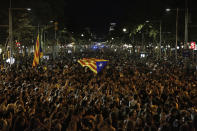 An "estelada" or independence flag is waved during a protest in Barcelona, Spain, Thursday, Oct. 17, 2019. Catalonia's separatist leader vowed Thursday to hold a new vote to secede from Spain in less than two years as the embattled northeastern region grapples with a wave of violence that has tarnished a movement proud of its peaceful activism. (AP Photo/Joan Mateu)