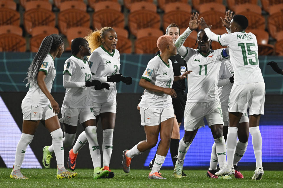 Zambia's Barbra Banda, second right, is congratulated by teammate Agness Musase after scoring her team's second goal from a penalty during the Women's World Cup Group C soccer match between Costa Rica and Zambia in Hamilton, New Zealand, Monday, July 31, 2023. (AP Photo/Andrew Cornaga)