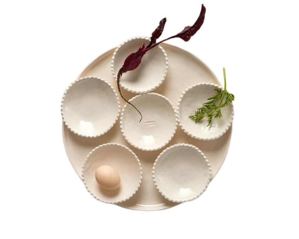 <p><a href="https://shop.thejewishmuseum.org/seder-plate-by-yaara?gad_source=1&gclid=CjwKCAiAloavBhBOEiwAbtAJOwRVfxS9Rau487cmSO3xrD7POuRAcSbIcLjOLBMt13Pxy4_oSfJEXRoCM6UQAvD_BwE" rel="nofollow noopener" target="_blank" data-ylk="slk:Shop Now;elm:context_link;itc:0;sec:content-canvas" class="link ">Shop Now</a></p><p>Scalloped Edge Seder Plate by Yaara</p><p>thejewishmuseum.org</p><p>$160.00</p>