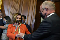 House Speaker Nancy Pelosi of Calif., talks with Louisiana Gov. John Bel Edwards during a ceremonial swearing-in photo opportunity with Rep. Troy Carter, D-La., on Capitol Hill in Washington, Tuesday, May 11, 2021. (AP Photo/Susan Walsh)