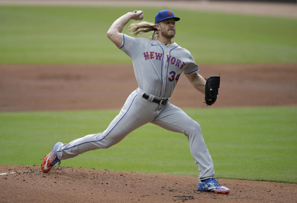 New York Mets pitcher Noah Syndergaard works against the Atlanta Braves in the first inning of a baseball game Sunday, Oct. 3, 2021, in Atlanta. (AP Photo/Ben Margot)