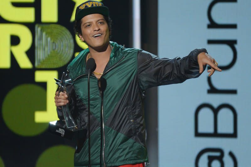 Bruno Mars accepts the award for Best Male R&B/Pop Artist during the 17th annual BET Awards at Microsoft Theater in Los Angeles in 2017. File Photo by Jim Ruymen/UPI