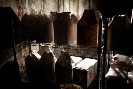 The unclaimed burial urns containing ashes of the dead are pictured at a facility which keeps the unclaimed urns in Yokosuka, Japan September 11, 2018. Picture taken September 11, 2018. REUTERS/Kim Kyung-Hoon